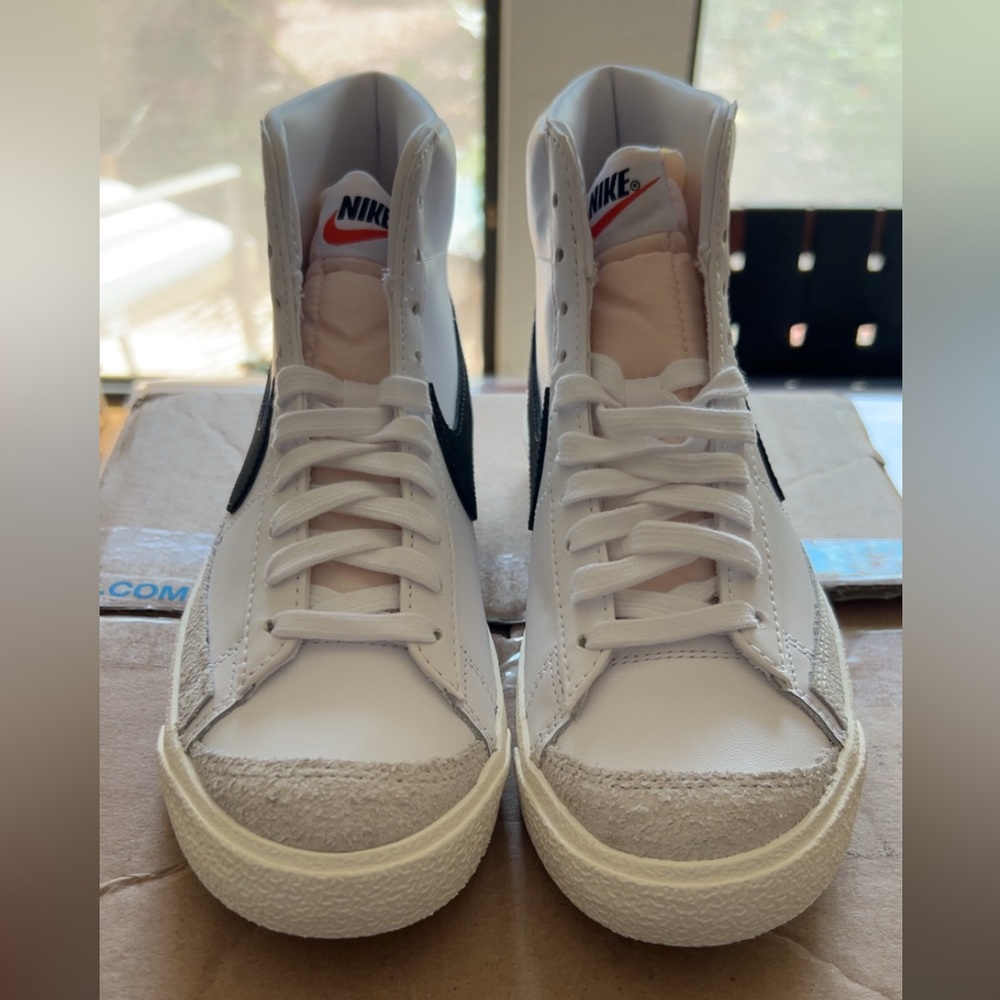 Nike White and Black High-Top Sneakers with Orange Tongue Logo